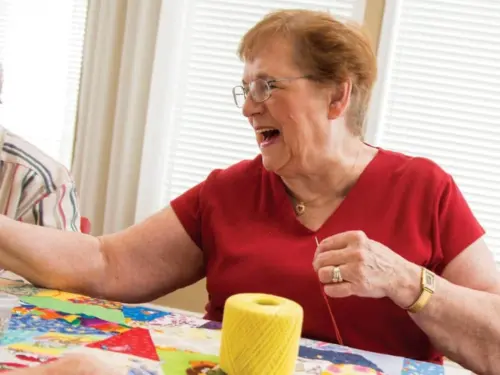 Resident participating in the quilting club​