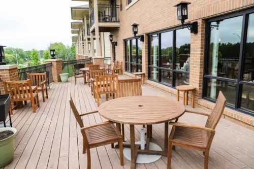 The Heritage at Legacy Outdoor dining area with tables and chairs