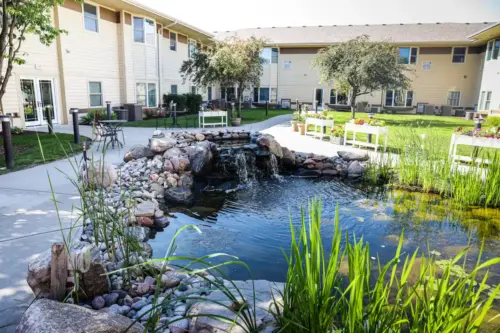 The Heritage at Meridian Gardens koi pond in the secure outdoor courtyard