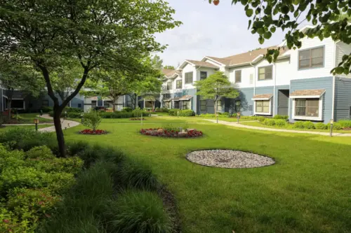 Heritage Ridge senior living secure outdoor courtyard with mature trees